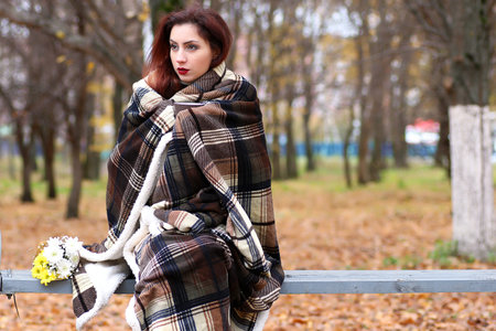 A pair of young people meets in autumnの写真素材