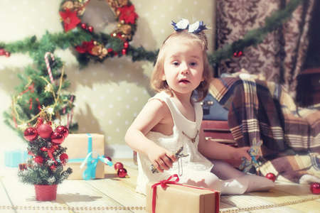 little girl and Christmas treeの写真素材