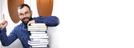 A bearded man with textbooksの写真素材