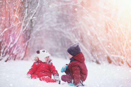 Young family with children are walking in the winter park. Winteの写真素材