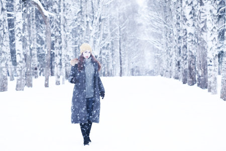 Beautiful girl in a beautiful winter snow