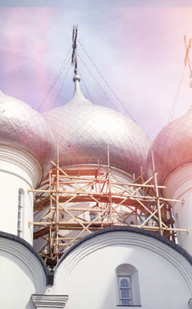 Domes of a religious building. Crosses on the domes of the church. Cathedral with silver domes against the sky
の写真素材