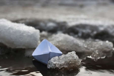 paper boat in a poolの写真素材