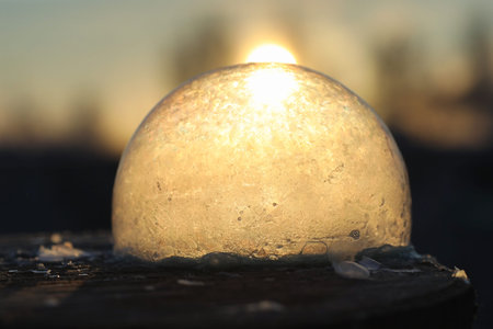 Soap bubbles freeze in the cold. Winter soapy water freezes in t
