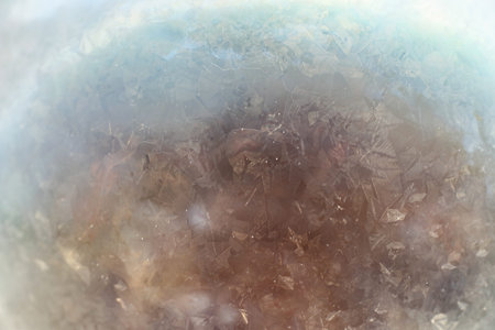 Soap bubbles freeze in the cold. Winter soapy water freezes in tの写真素材