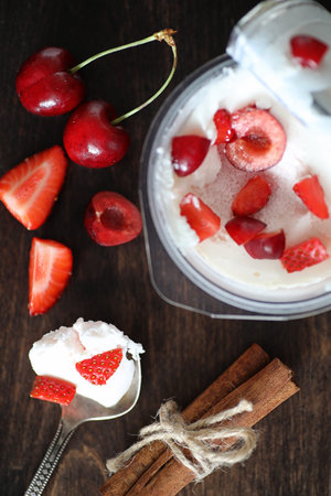 Yoghurt with fresh strawberries and cherries
