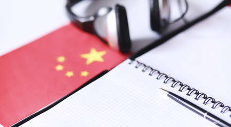 Learning foreign languages. Notepad for entries and a flag. Langの写真素材