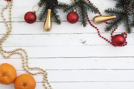 New Years background. Spruce branches on a wooden table. Ornament
