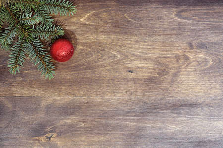 New Years background. Spruce branches on a wooden table. Ornamentの写真素材