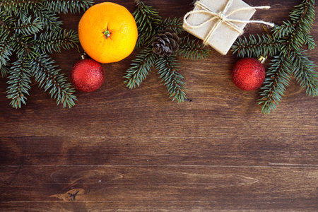 New Years background. Spruce branches on a wooden table. Ornameの写真素材