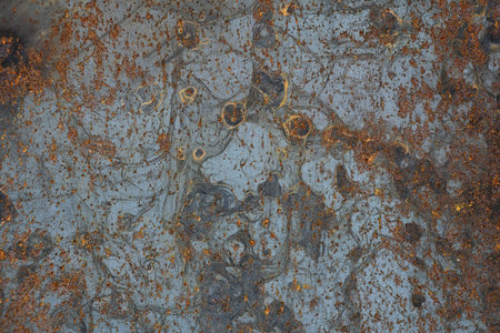 The texture is metallic. Industrial background from an old rusty