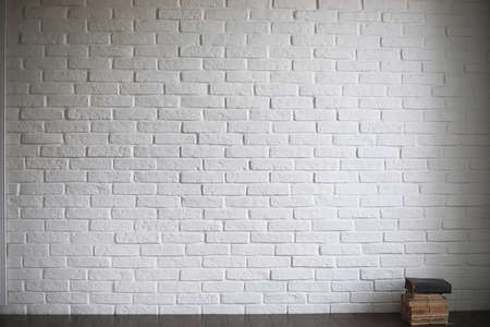 Asian young novice on a white brick wall background
の写真素材