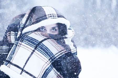 Beautiful girl in a beautiful winter snowの写真素材