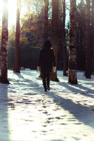 snow winter portrait female outdoor in a parkの写真素材