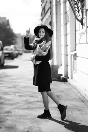 Black and white photo of a young girl on a walkの写真素材