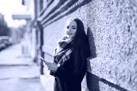 Black and white photo of a young girl on a walkの写真素材
