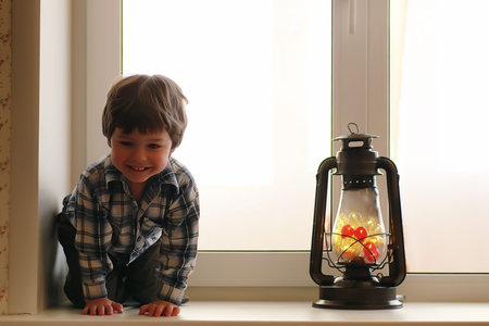 A child in the new year looks out the window. Children are waiti