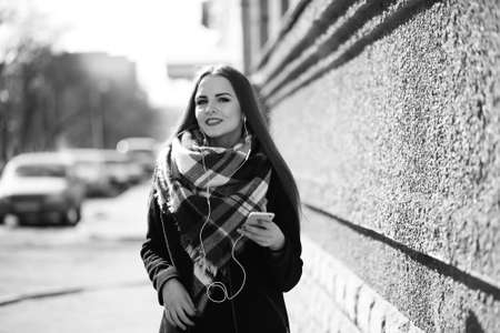 Black and white photo of a young girl on a walkの写真素材