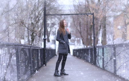 Model girl posing outdoors in winter
