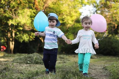 Little children are walking in a park