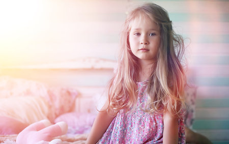 Young girl reads a book Young girl with a daughter are sitting oの写真素材