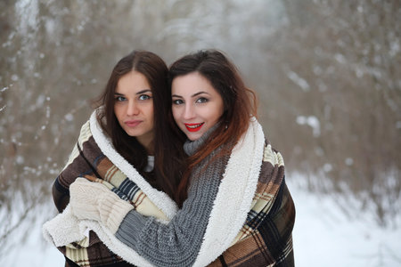 Beautiful girl in a beautiful winter park