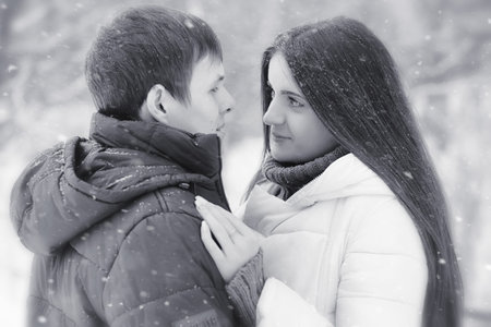 A loving couple on a winter walk. Man and woman on a date in the