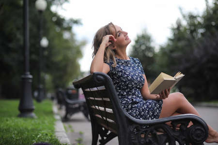 Beautiful girl in the summer parkの写真素材