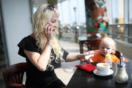 Beautiful young businesswoman in working breakの写真素材