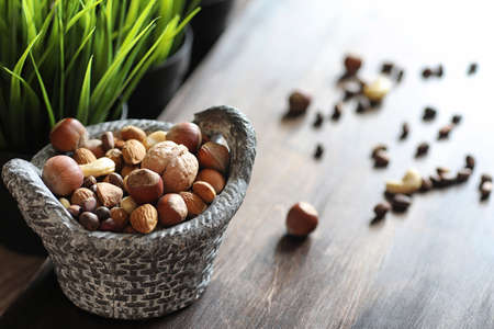 tasty nuts on a wooden tableの写真素材