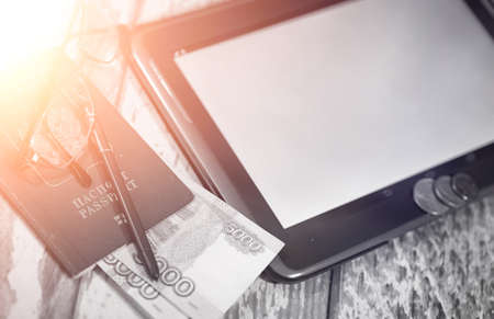 The graph of income growth. Electronic tablet with a graphの写真素材
