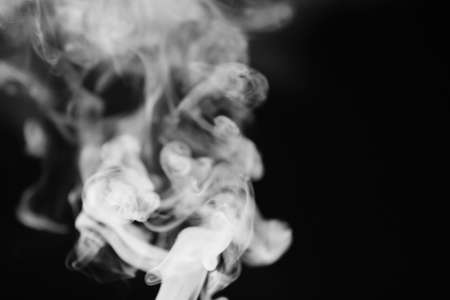White smoke on a black background. Texture of smoke. Clubs of whの写真素材