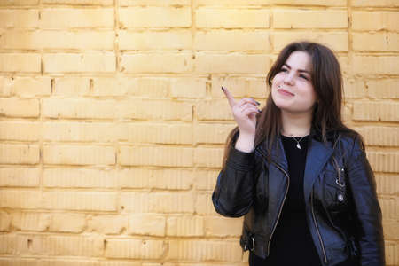 Cute girl in an autumn parkの写真素材