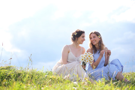 Beautiful girls on a summer day walkingの写真素材