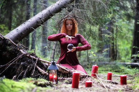 Witch holds a ritual sphere