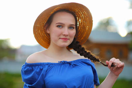 Girl in the countryside in the eveningの写真素材