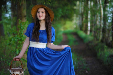 Girl in the countryside in the eveningの写真素材
