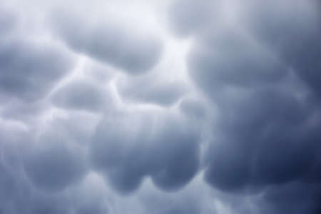 Rain clouds in the sky. Gray dark clouds in the sky. Storm cloudの写真素材