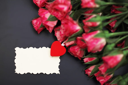 Bouquet of red roses on black matte background