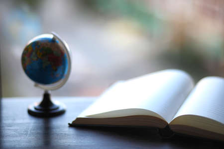 open book and a table in front of the window
の写真素材