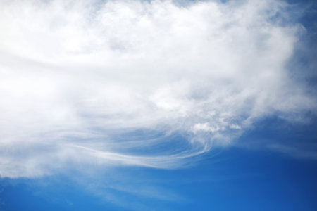 white clouds in the blue sky at noon summer