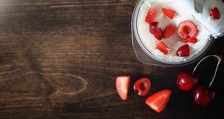 Fresh yogurt berries. Ice cream in a bowl with fresh and juicy strawberries and cherries. Dessert...