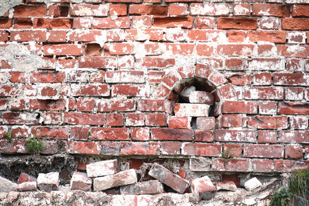 Old brick wall with a crack