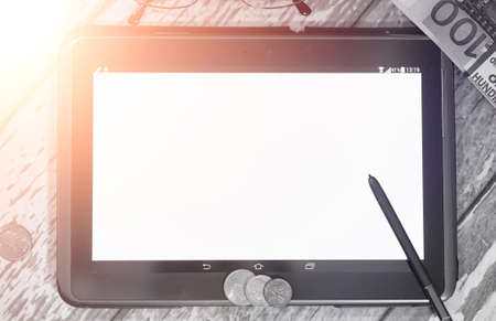 The graph of income growth. Electronic tablet with a graph of grの写真素材