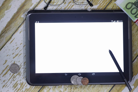 The graph of income growth. Electronic tablet with a graph of grの写真素材