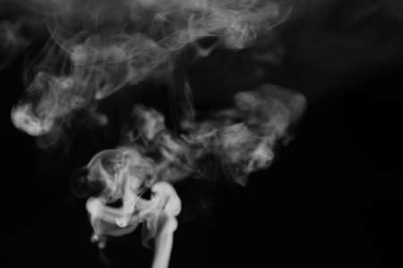 White smoke on a black background. Texture of smoke. Clubs of whの写真素材