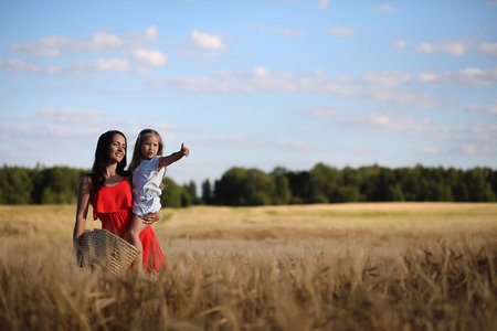 Summer landscape and a girl on nature walk in the countryside.の写真素材