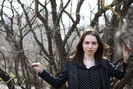 Girl on a walk through the spring cityの写真素材