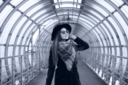 Young adult girl in the architectural tunnelの写真素材