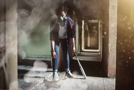 A young person with a baseball batの写真素材